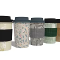 Modern Coffee Cup Set with Various Patterned Sleeves and Colorful Designs