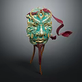 Intricate Green Mask With Detailed Golden Decorations And Red Ribbons On Stand