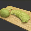 Fresh Avocado Whole and Sliced with Lime on Wooden Cutting Board