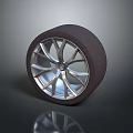 Black Rubber Tire With Silver Alloy Wheel And Reflective Rim Design