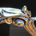 Elegant Mirror With Ornate Gold Frame And Intricate Carving Details