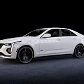 Cadillac White Sedan with Sleek Body Design and Sporty Black Wheels in Studio Lighting Setup
