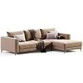 Modern L Shaped Upholstered Sofa in Neutral Tones With Throw Blanket Decorative Pillows and Balls