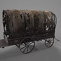 Vintage Covered Wagon With Tattered Canvas Top And Wooden Wheels