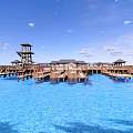 Scenic Waterfront Area With Wooden Pier Observation Tower Pavilions And Clear Blue Sky