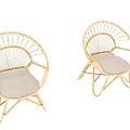 Two Rattan Leisure Chairs with Round Woven Backrest and Light Colored Cushioned Seats