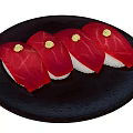 Four Pieces of Fresh Tuna Sushi on Black Plate with Wasabi