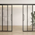 Modern Black Frame Glass Sliding Doors In Interior With Wooden Floor And Plant