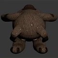 Brown Puppy Plush Toy With Big Ears Round Eyes And Sitting Position On Shiny Surface