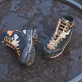 Black And Orange Outdoor Hiking Boots With White Laces And Slip Resistant Outsole