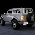 Gray Two Door SUV with Rugged Exterior Design and Large Off Road Tires