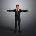 Man In Black Suit With Sunglasses Standing With Arms Outstretched Against Gray Background