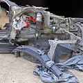 Helicopter Wreckage With Damaged Parts And Debris Scattered On Ground After Accident