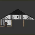 Traditional Barn Style Building With Black Roof White Brown Walls And Columns