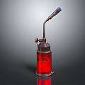 Vintage Red Glass Bottle With Metal Nozzle And Brass Valve On Reflective Surface