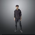 Child Standing In Dark Hoodie And Dark Pants Against Grey Background