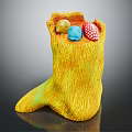 Yellow Textured Boot Shaped Container Holding Colorful Balls Yellow Blue And Polka Dot