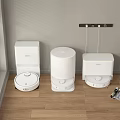 Household Appliances Including Three White Robotic Vacuum Cleaners On Indoor Wooden Floor