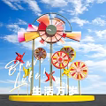 Colorful Windmill Sculpture with Long Live Life Lettering and Blue Sky
