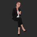Woman in Black Blazer White Top Black Pants with Clasped Hands Sitting Against Dark Background