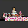 Colorful Birthday Party Food Display with Decorated Cake Candles Cups and Snacks