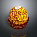 Golden Wrapped Round Chocolate in Brown Paper Cup with Shiny Surface