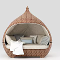 Rattan Woven Dome Shaped Hammock with Cushions and Light Colored Padding