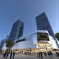 Modern Commercial Street With Tall Glass Buildings And Shopping Mall Outdoor Area And Bright Lighting