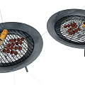 Two Round Gray Grills With Meatball Skewers And Sausages On Grates