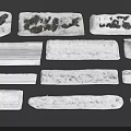 Natural Snow Covered Stones with Various Textures and Shapes in Winter Landscape