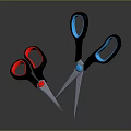 Two Crossed Scissors With Red And Blue Handles And Metal Blades On Dark Background