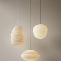 Stylish Paper Pendant Lights With Striped Design Hanging Against Light Colored Background