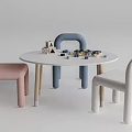 Round White Kids Table with Building Blocks Toys and Curved Chairs in Pink Blue White