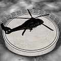 Modern Helicopter Parked On Green Helipad With Yellow Red Lines And Rotors