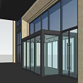 Modern Commercial Storefront With Large Glass Windows Light-Colored Pillars And Metal Frames