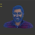 Man with short black hair and beard wearing purple striped polo shirt against gray background
