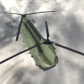 Green Military Transport Helicopter Flying With Landing Gear Extended In Blue Sky Clouds