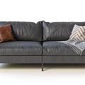 Modern Gray Leather Double Sofa With Brown And Patterned Pillows And Gray Blanket 3d model