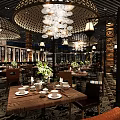 Chinese Style Restaurant Interior With Black Lattice Chandeliers Round Tables Patterned Carpet And Green Plants