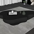 Modern Black Irregular Shaped Coffee Table On Beige Rug With Decorative Items 3d model