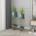 Blue Ceramic Planters On Gold Metal Plant Stands In Modern Room With Gray Curtains