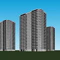 High Rise Residential Buildings With Green Trees Lawn And People Relaxing Under Blue Sky
