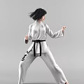 Woman In White Taekwondo Uniform With Black Belt Performing Martial Arts Moves On Gray Background