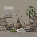 Wicker Lounge Chairs In Cozy Indoor Setting With Potted Plant Decorative Painting And Wooden Table