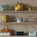 Various Stylish Handbags In Different Colors Displayed On Shelves With Neutral Background