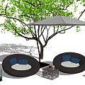Round Outdoor Sofa With Blue Cushions Under Grey Umbrella And Green Tree