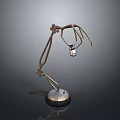 Curved Metallic Mechanical Arm With Hanging Transparent Sphere And Round Base