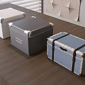 Three Storage Boxes White Gray Blue with Metal Corners Leather Straps on Wooden Table