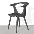 Black Modern Dining Chair With Curved Backrest And Armrests On Slim Wooden Legs