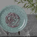 Celadon Plate With Dragon Relief Decorative Ornament Set On Wooden Stand And Bamboo Plant